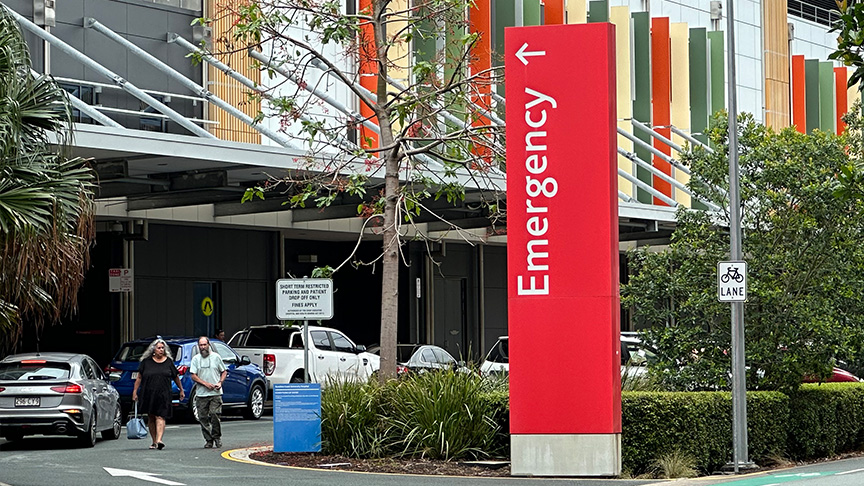 Red road sign pointing to the Emergency Department entrance