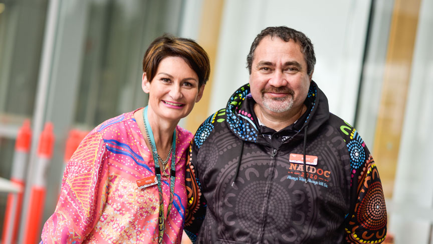 Two people celebrating NAIDOC week outside Sunshine Coast University Hospital