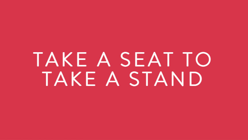 Take a seat to take a stand (white text on a red background)